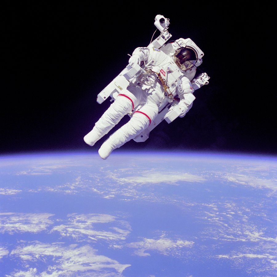 Astronaut in a spacesuit against Earth's horizon, illustrating the Space Explorers topic