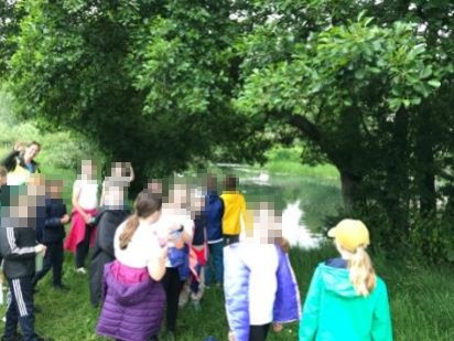 Year 5 children by the river on a riverwalk